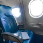 Cómo enganchar un asiento libre a tu lado en un vuelo y el error que todos cometen